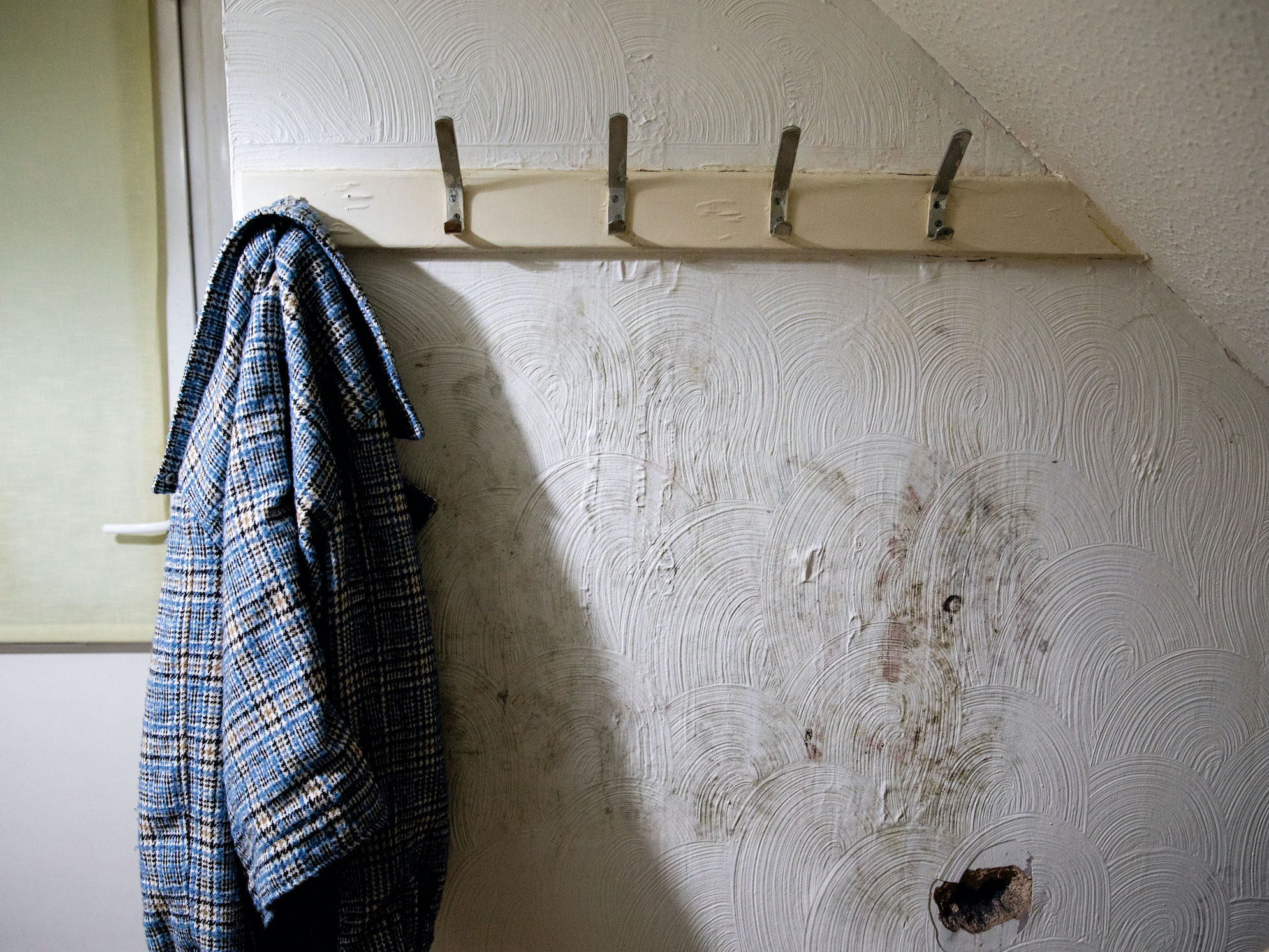 The patch of mould that spread onto his father's jackets